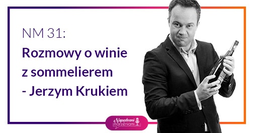 sommelier Jerzy Kruk trzyma wino